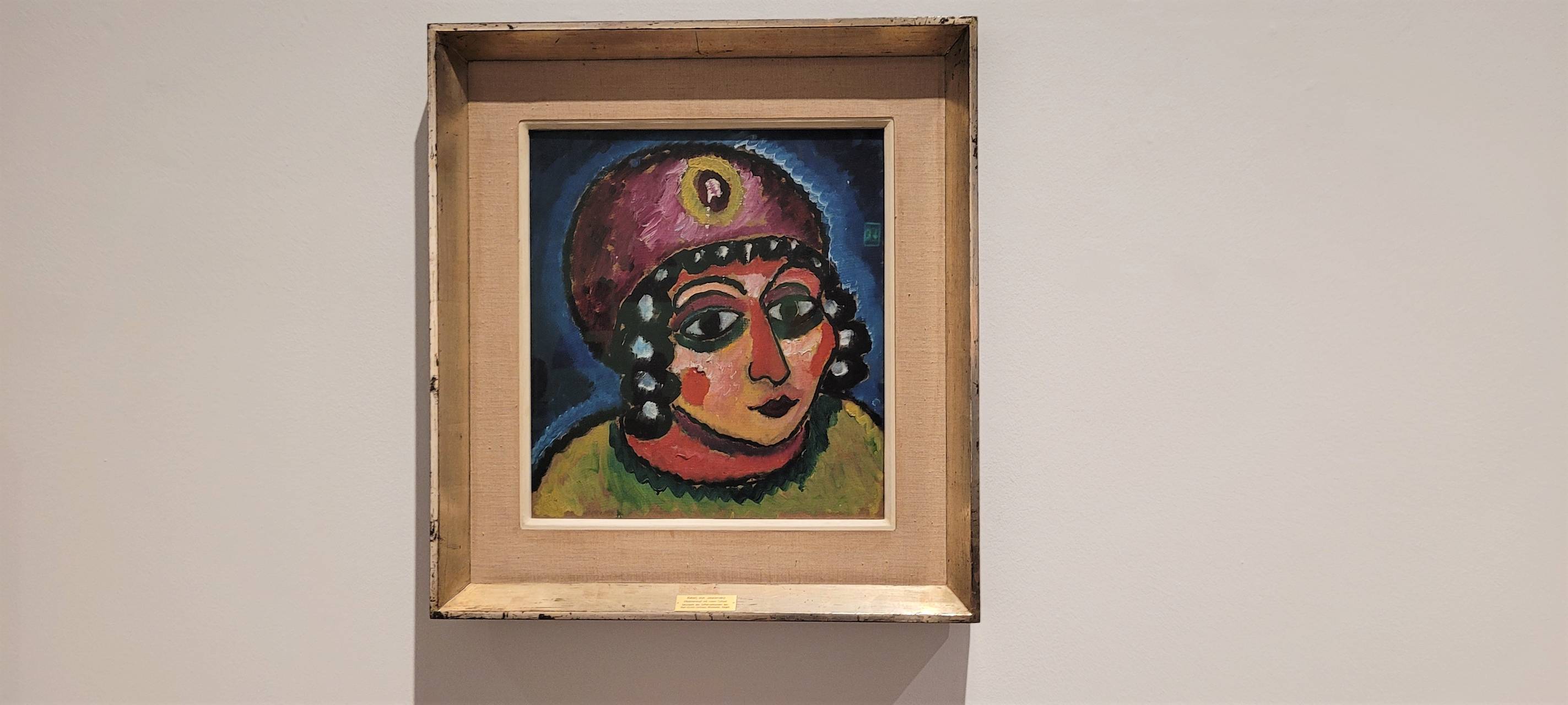 Das Bild zeigt einen goldenen Bilderrahmen, darin ein Originalwerk von Pablo Picasso